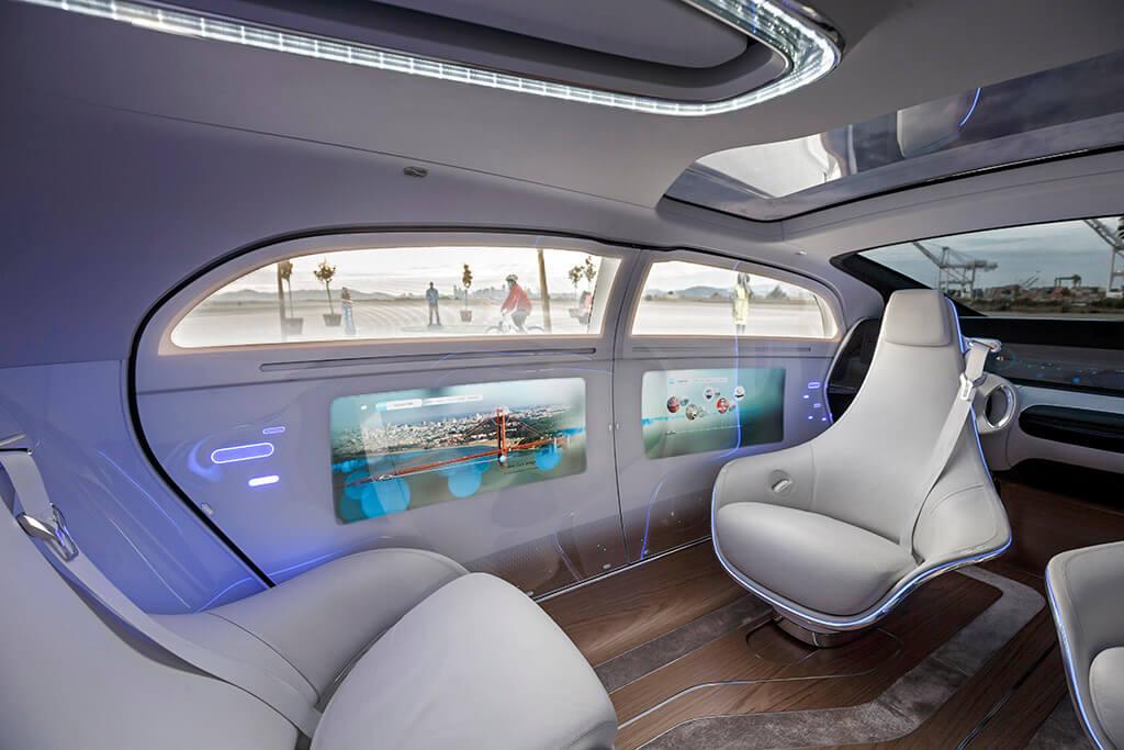 Futuristic fully autonomous vehicle interior with lounge seats and ambient displays