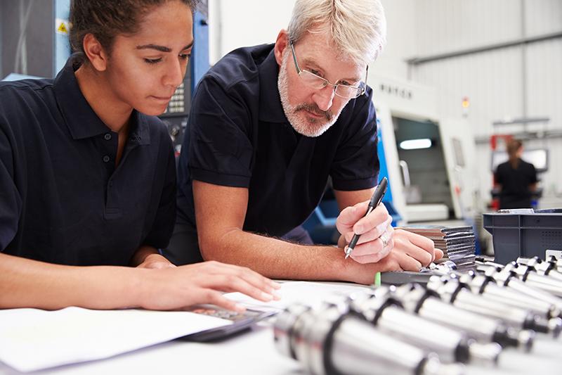 Engineers reviewing automotive connector specifications